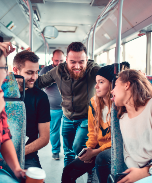 A group of people sitting on a bus