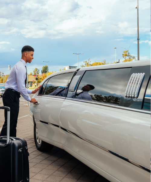 A man standing next to a white car