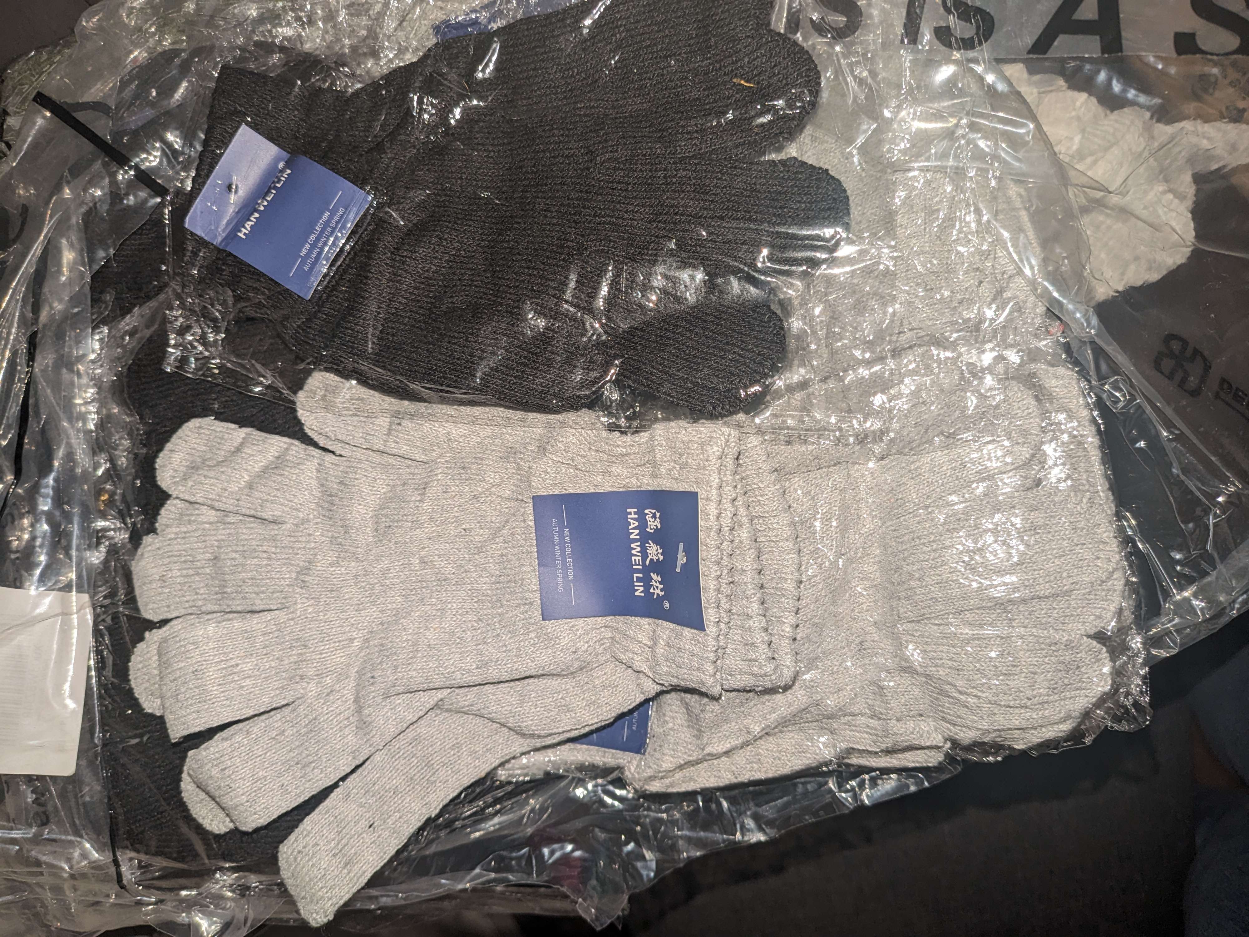 A package of gloves and mittens sitting on top of a plastic bag