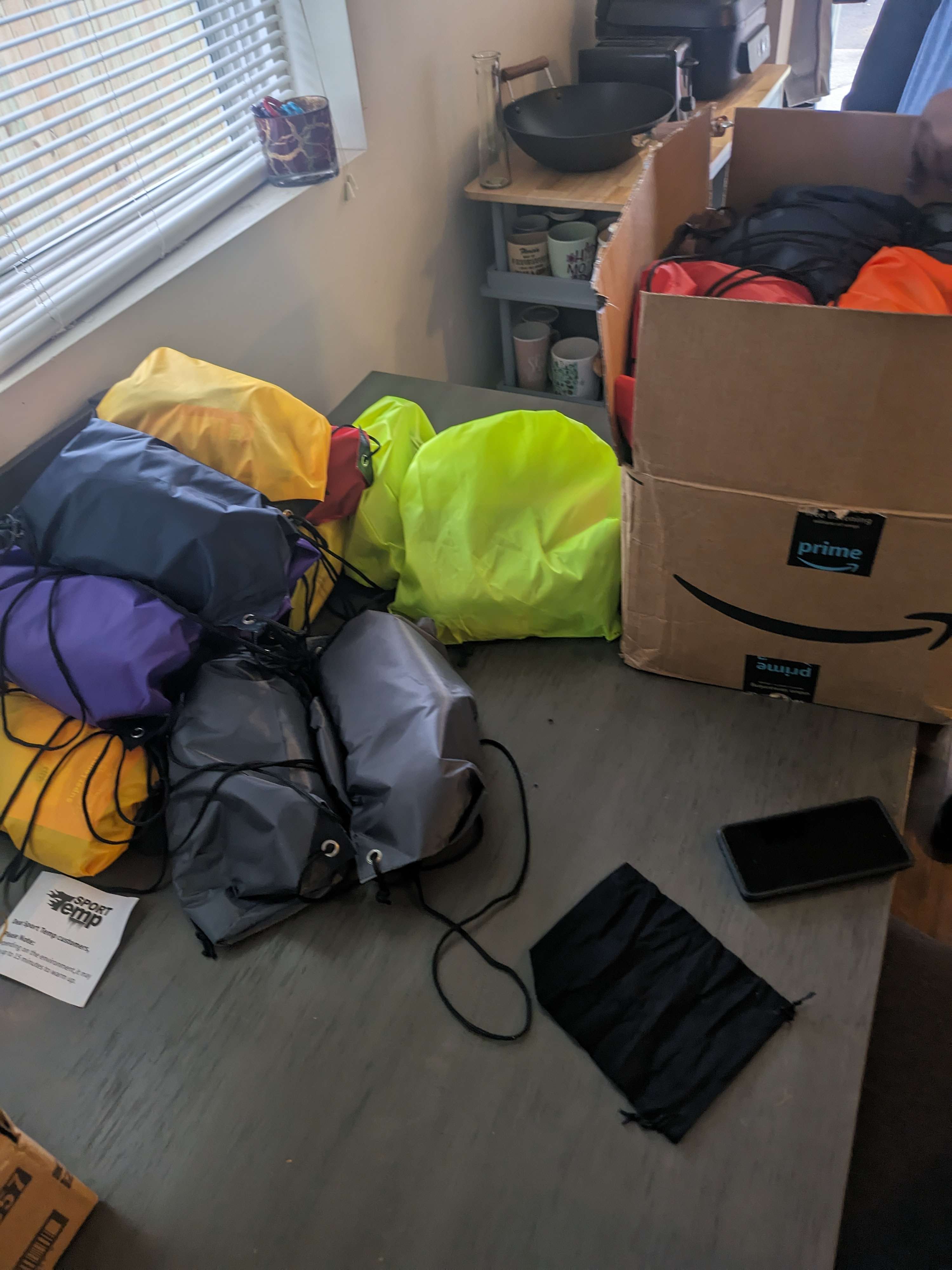 A pile of luggage sitting on top of a wooden floor